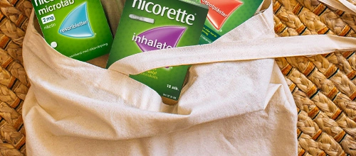Bag containing Nicorette Microtabs, Nicorette Inhalator and Nicorette Invisipatch products